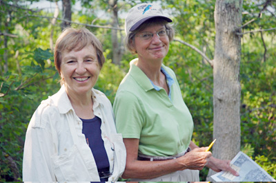 Hanson-Powell volunteer land stewards Olga Mitchell and Ann Menashi