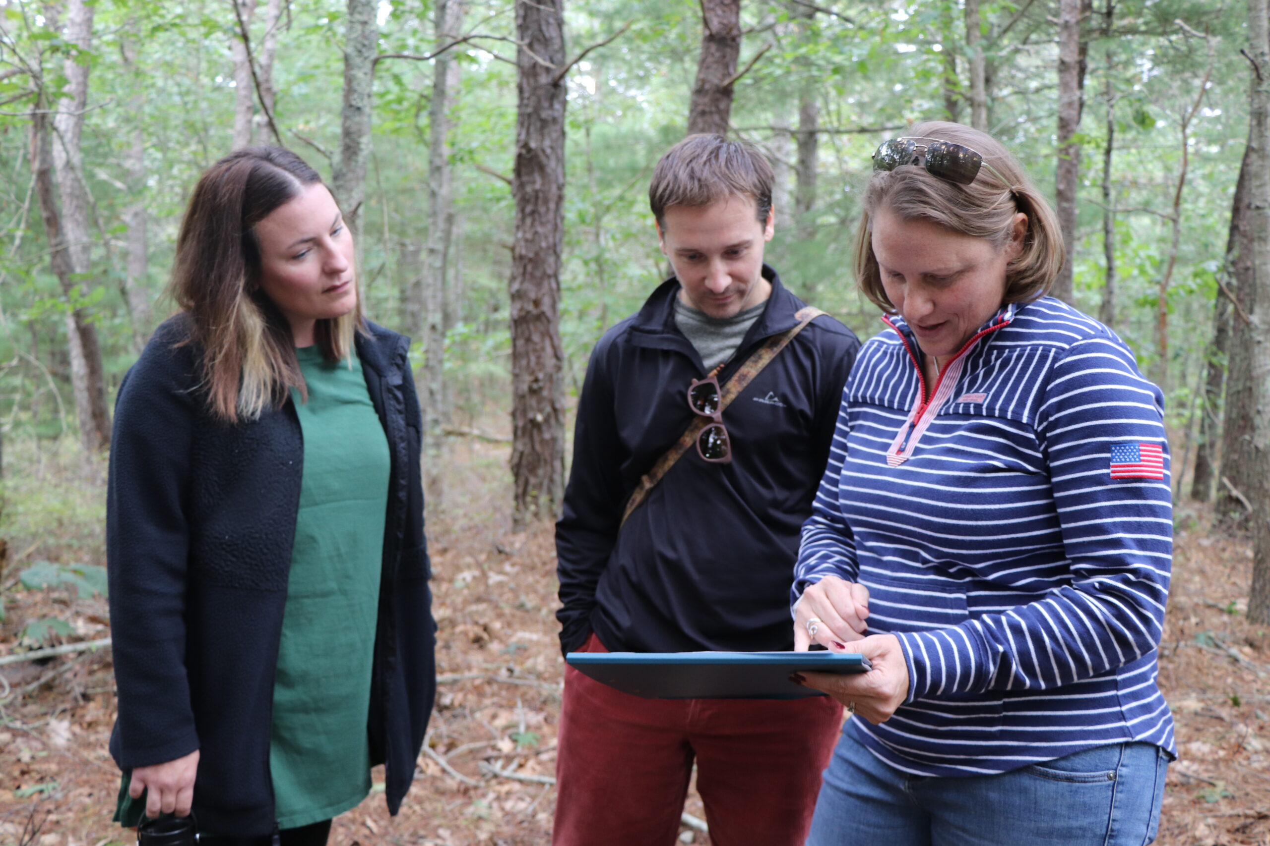 300 Committee Executive Director Jessica Whritenour shows preliminary plans for a network of public walking trails.